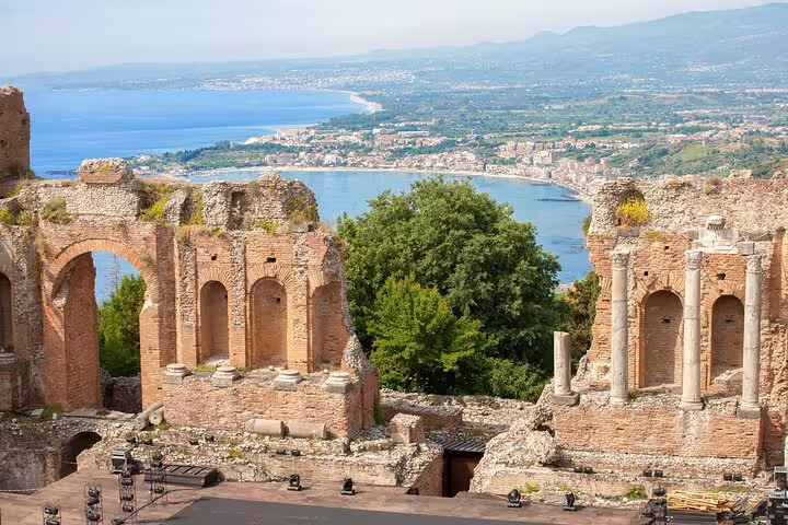 Ruins of the Greek Theatre in Taormina with panoramic views of the Ionian coastline on a 2-hour private walking tour