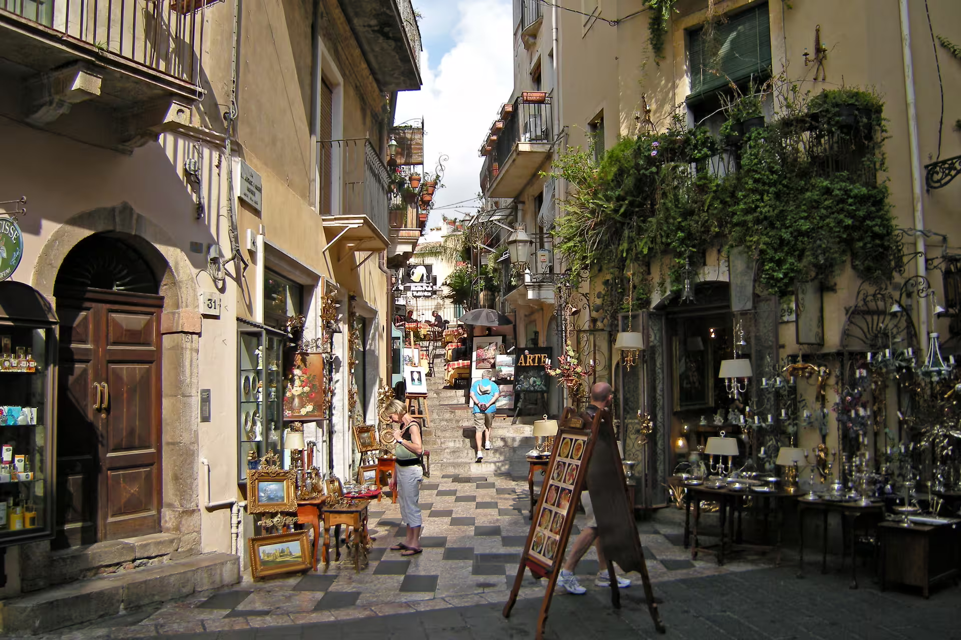Taormina old town street with artisan shops and balconies, part of Mount Etna and Taormina tour