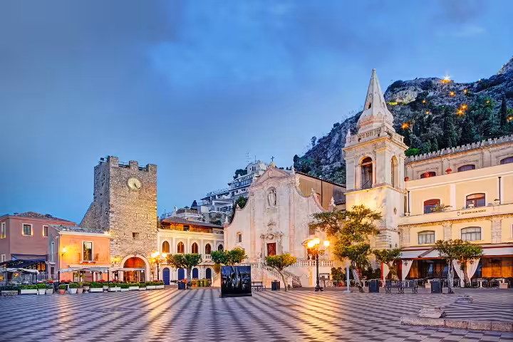 Taormina Piazza IX Aprile at sunset with church and clock tower, scenic stop on Messina port Godfather tour
