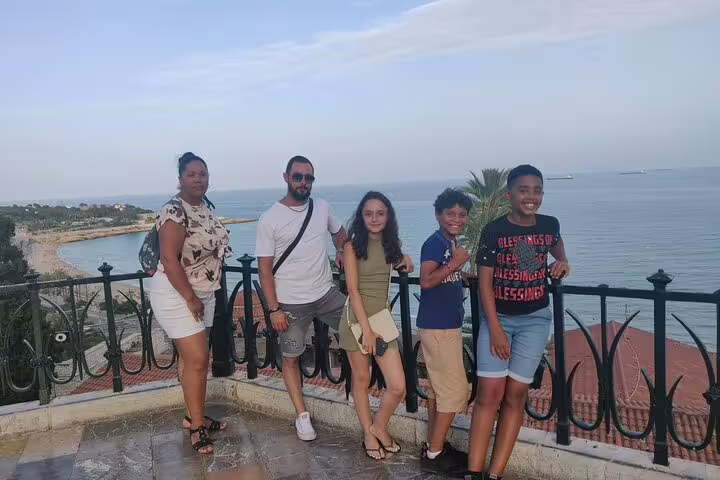 Group at a Tarragona coastal lookout during a self-guided scavenger hunt tour with Mediterranean views