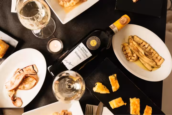 Taurasi light tasting with Irpinia wine, grilled vegetables, local bites and glasses on a rustic table
