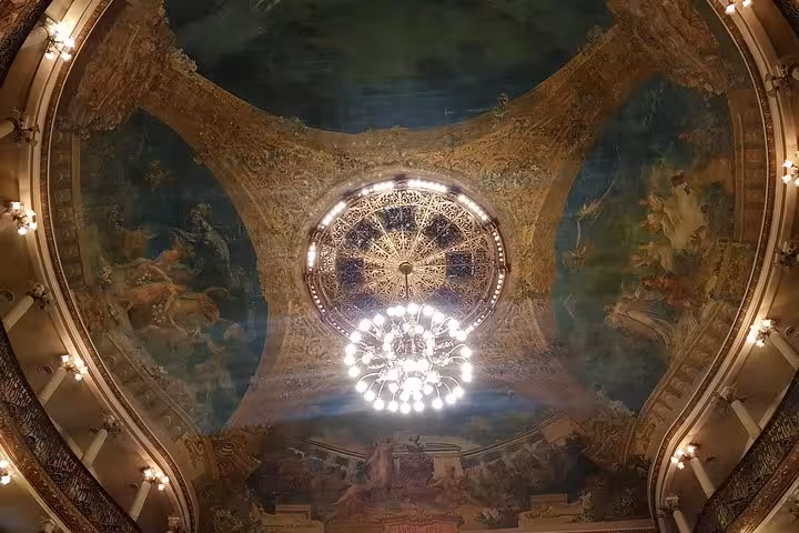 Ornate ceiling and chandelier inside Teatro Amazonas, iconic landmark visited on a guided Manaus city tour