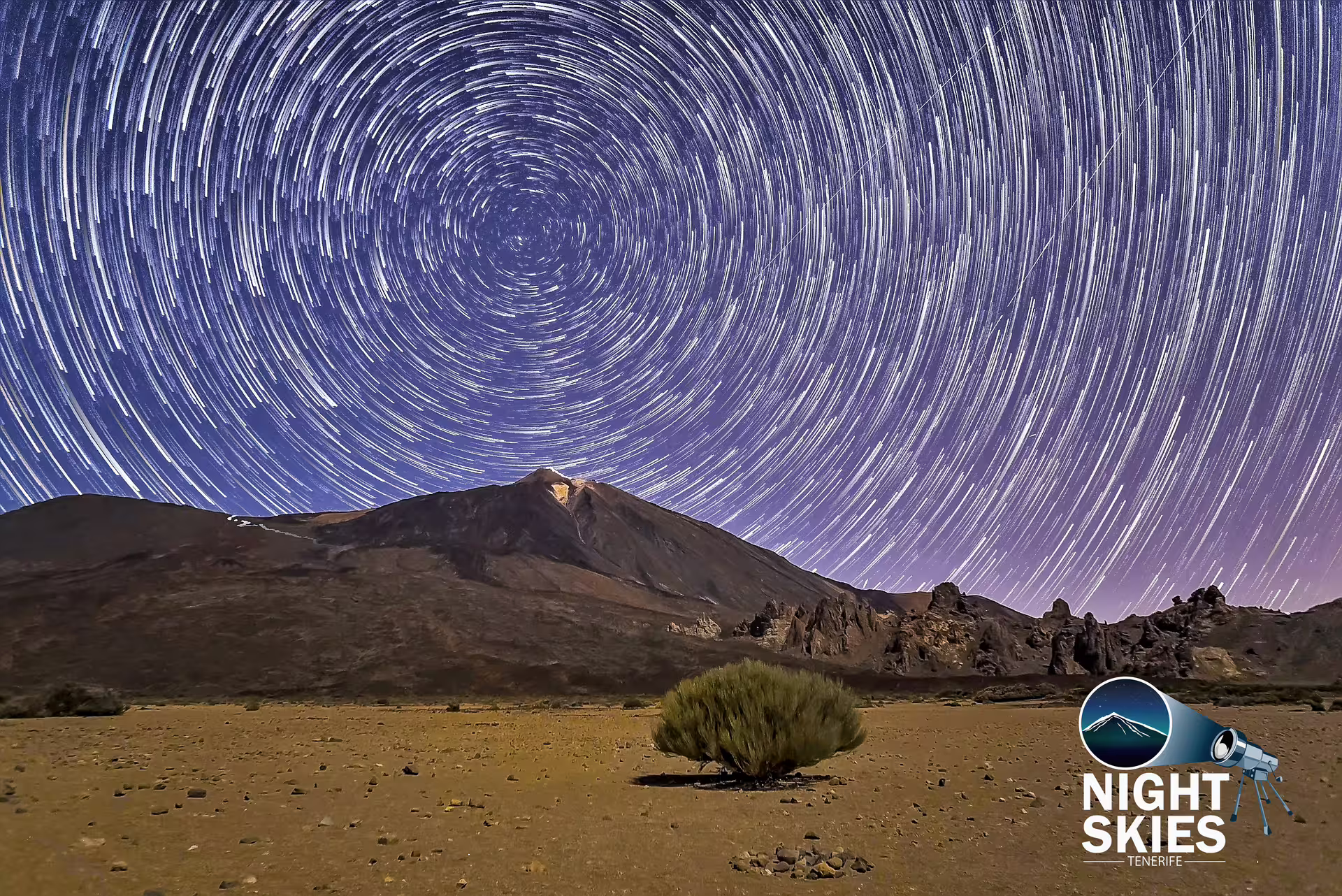 Star trails over Mount Teide, Tenerife, showcasing stunning night sky perfect for stargazing tours.