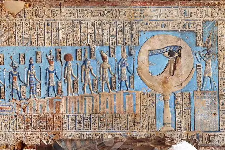 Colorful ancient Egyptian wall relief with hieroglyphs at Tell el-Amarna, highlight of a private day tour