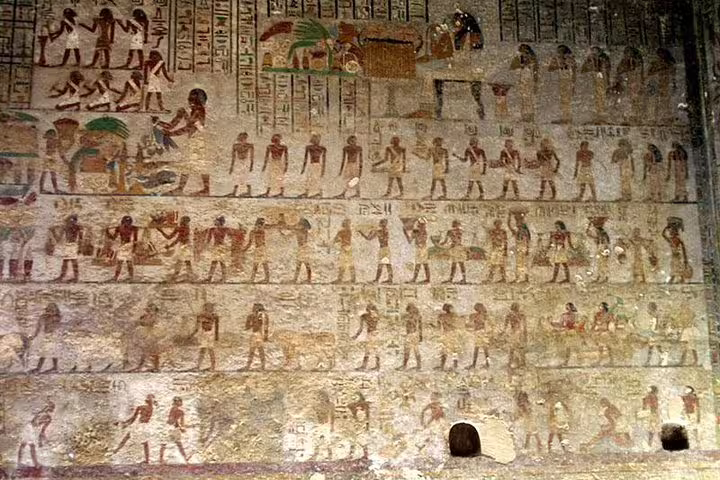 Colorful ancient Egyptian wall reliefs in an Amarna tomb, seen on Tell el-Amarna unusual private day tour