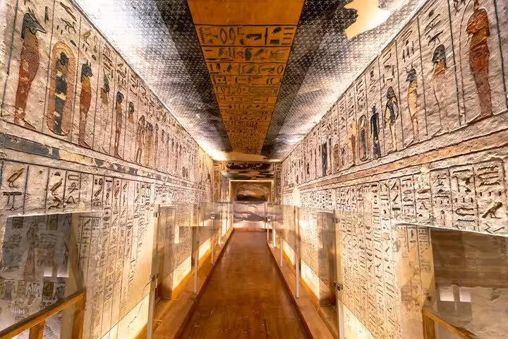 Ancient Egyptian hieroglyph corridor inside Luxor tomb, part of Temple of Hatshepsut 5-day tour from Cairo