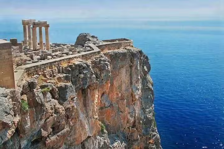 Temple of Poseidon at Cape Sounio cliff above the Aegean Sea on a private full-day Athens tour