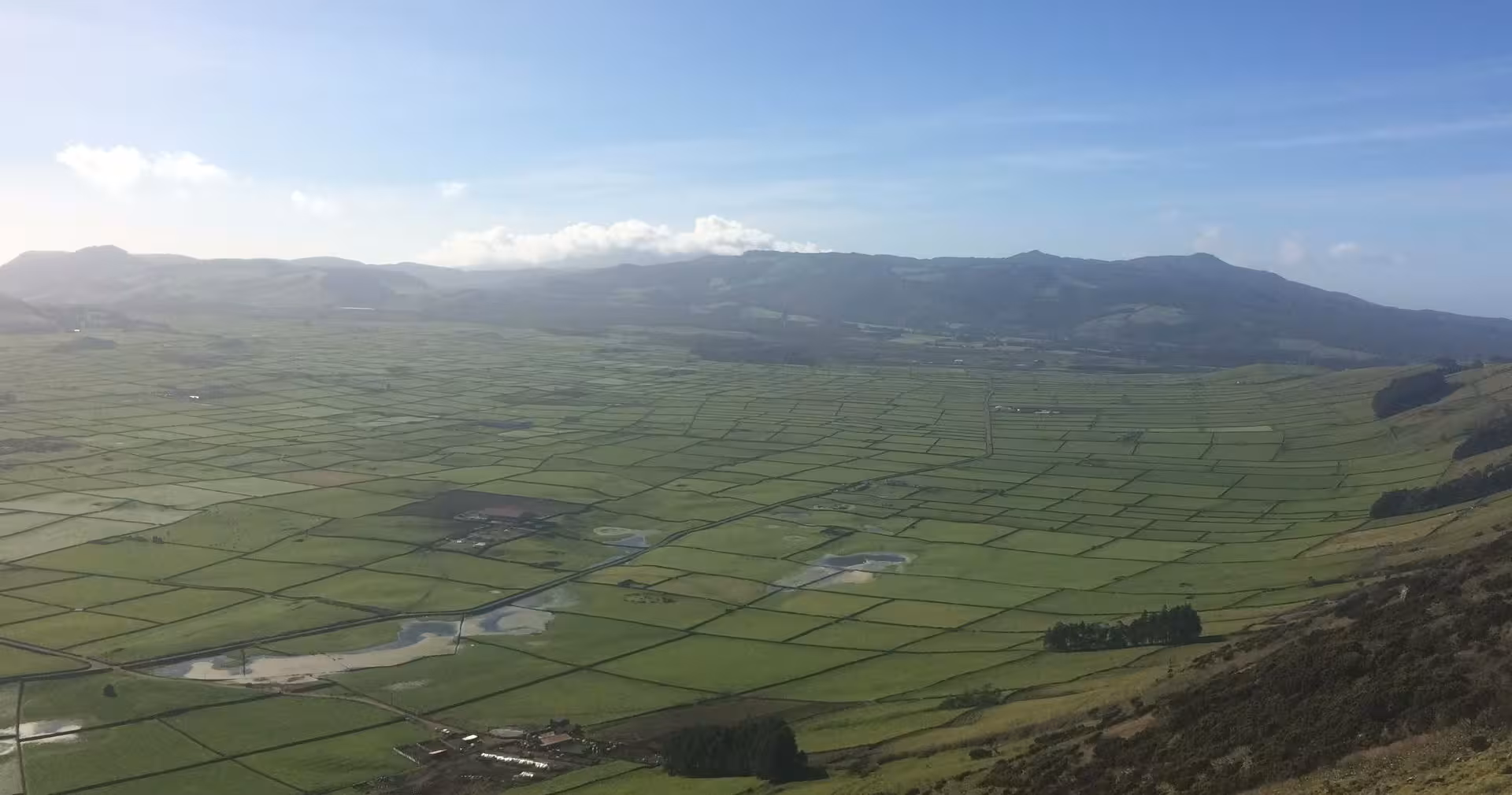 Panoramic view of Terceira’s green patchwork fields and hills on the East of Terceira midday van tour