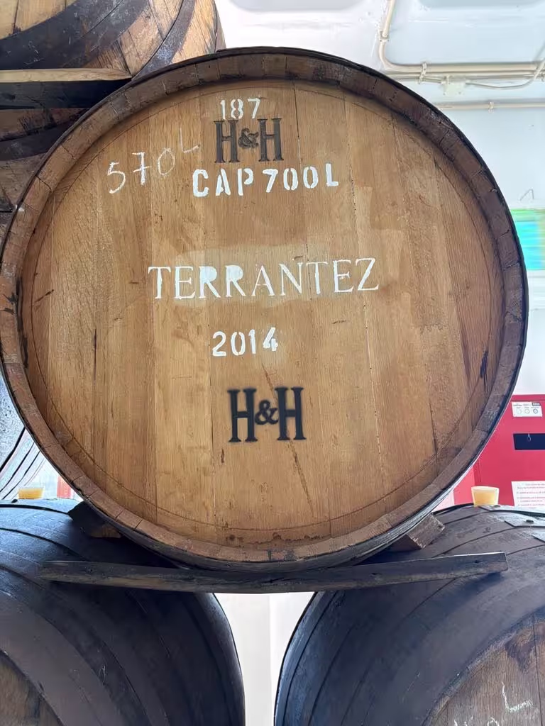 Close-up of a Terrantez wine barrel from 2014, highlighting traditional winemaking on the holy wine tour.