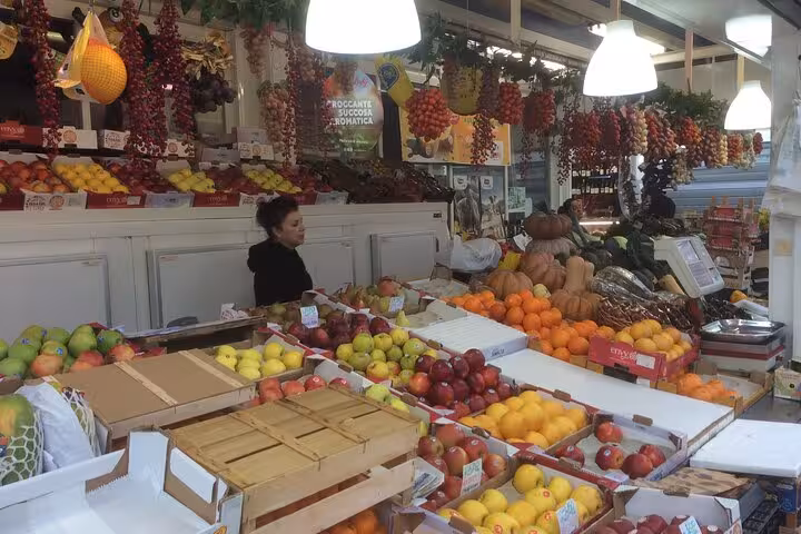 Vibrant Testaccio market stall with fresh fruits and vegetables, capturing the essence of Rome's culinary scene.