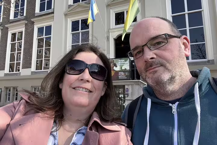Couple smiling in front of Haags Historisch Museum during The Hague old town walking tour