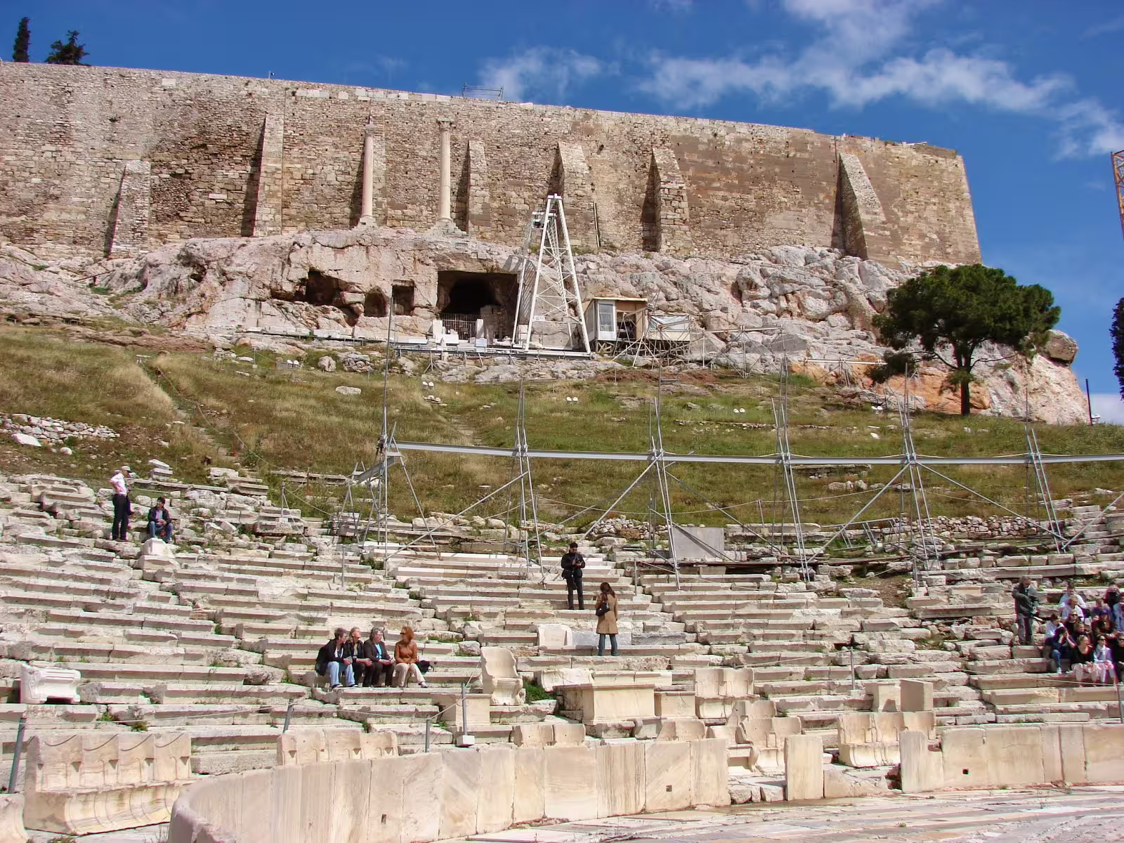 Theatre of Dionysus seating beneath Acropolis walls in Athens, highlight of Acropolis Museum guided tour