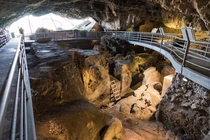 Theopetra Cave interior walkway and excavations, cultural stop on Thessaloniki to Meteora private day trip