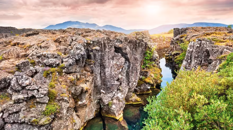 Rocky canyon with crystal clear water stream at Thingvellir National Park, Iceland Golden Circle