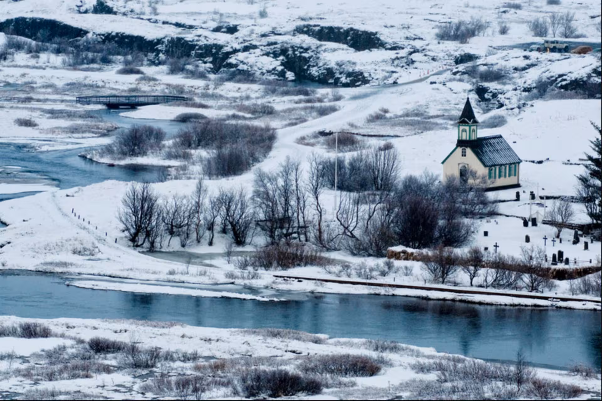 Þingvellir church and snowy landscape along river in Iceland's Golden Circle in winter