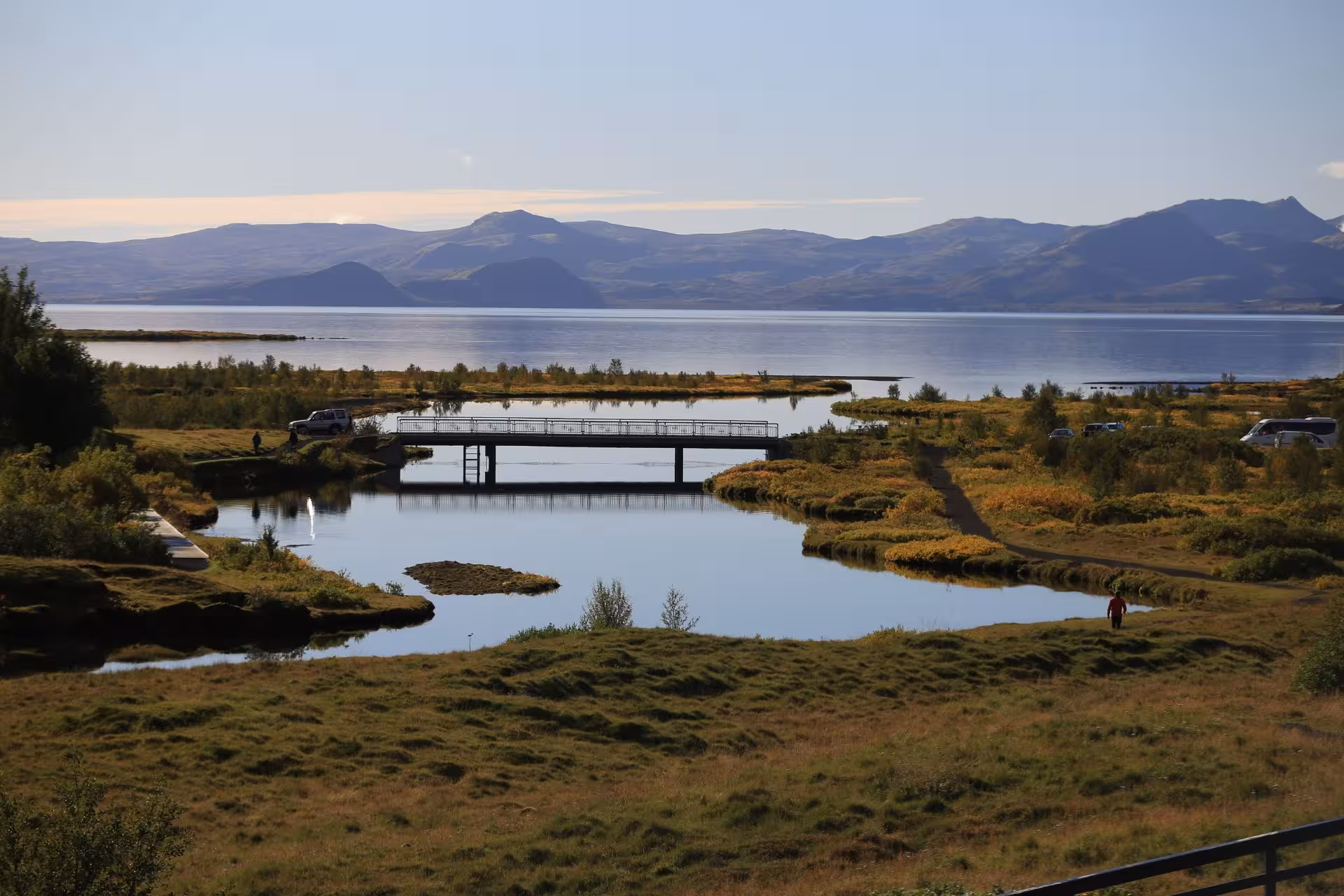 Scenic Þingvellir lake and bridge with mountains in background, Golden Circle Iceland