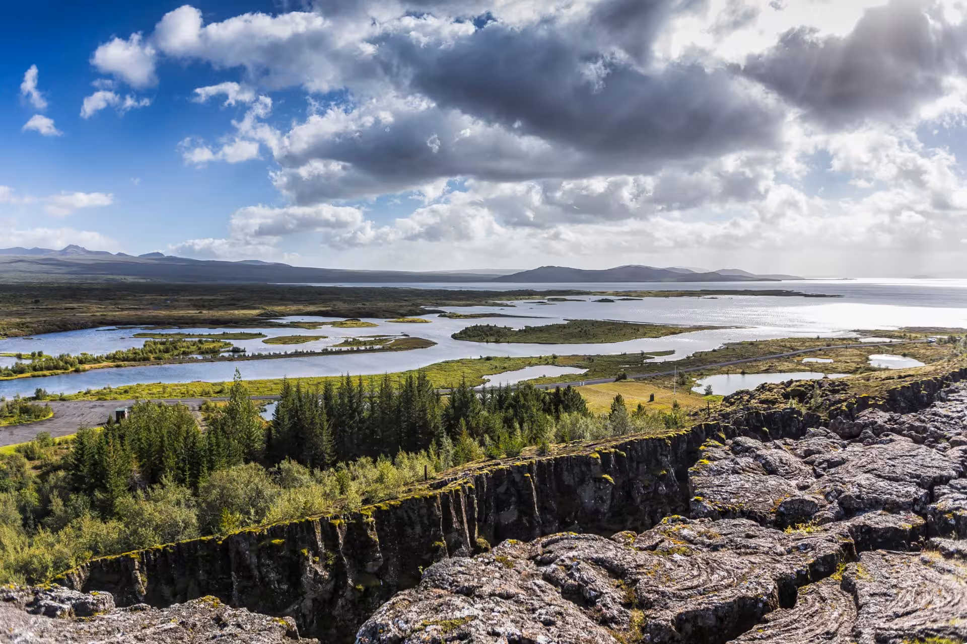 Panoramic view of Þingvellir National Park with tectonic rift, wetlands, and Lake Þingvallavatn, Iceland