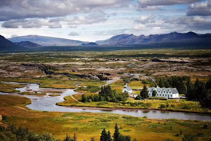 Aerial view of Þingvellir National Park with church, river, and mountains on Iceland's Golden Circle