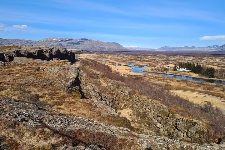 Þingvellir rift valley with river and white buildings, Golden Circle Iceland landscape