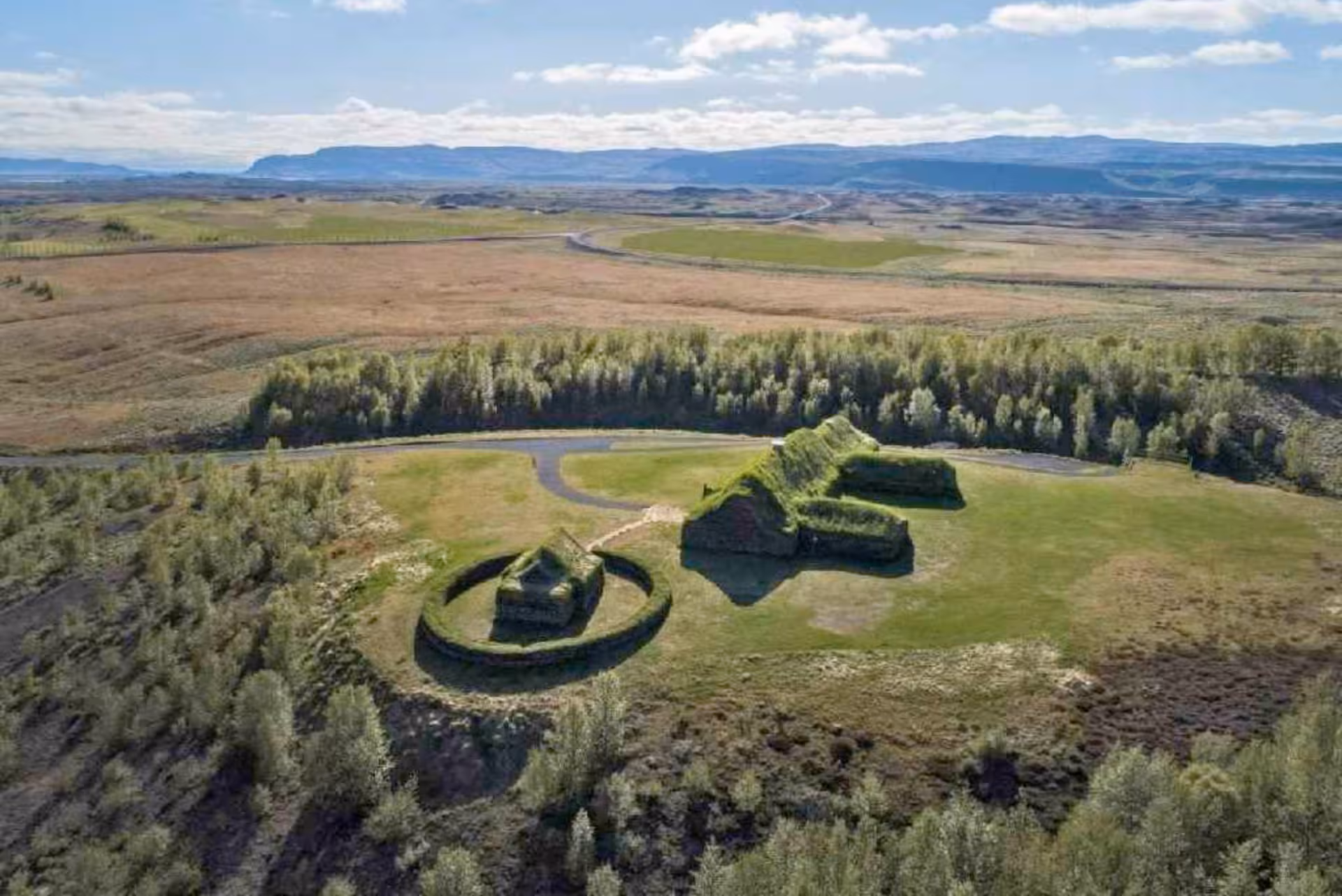 Aerial view of Þjórsárdalur Valley on a private tour, showing Stöng ruins and green fields in South Iceland