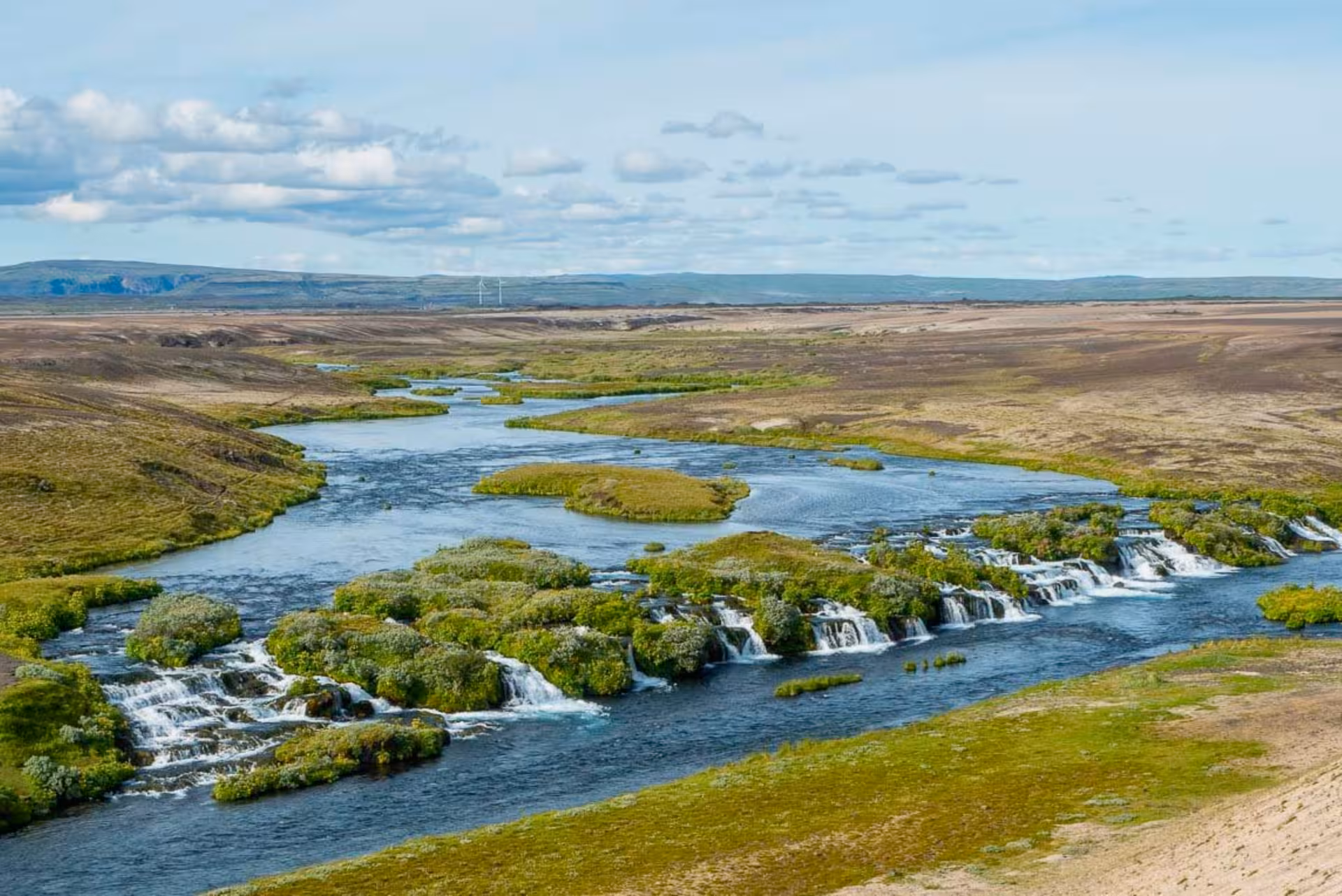 Wide view of Þjórsá river braids and small rapids in Þjórsárdalur Valley, Iceland private tour stop