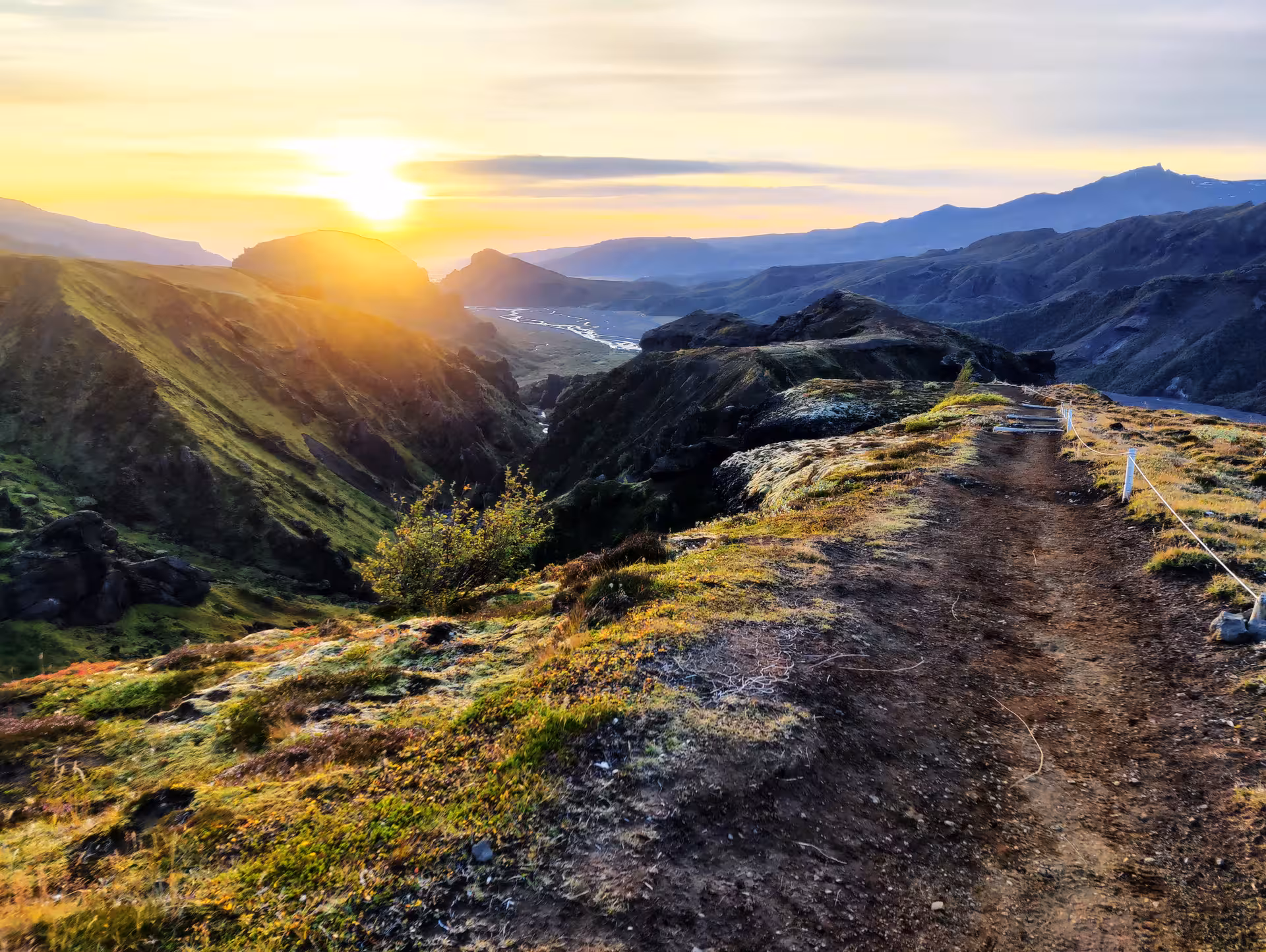 Sunset over Thorsmork valley with a winding hiking trail and river views in South Iceland
