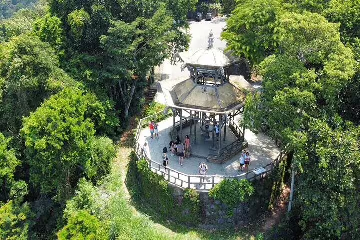 A scenic aerial view of a gazebo surrounded by lush greenery in Rio's Tijuca Rainforest, ideal for a half-day jeep tour.