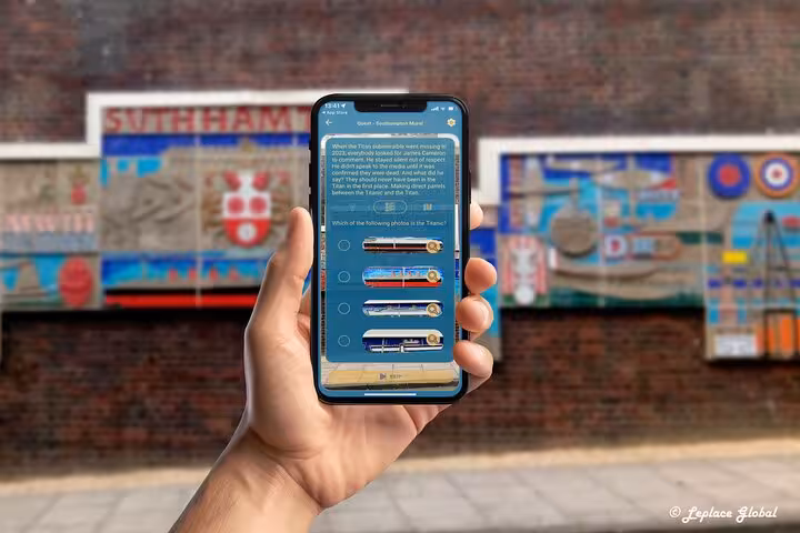 Engaging Titanic quiz on mobile app during self-guided walking tour near colorful Southampton city center heritage mural