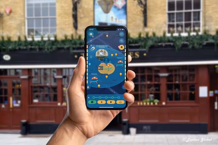 Interactive Titanic history tour app displayed on phone outside historic Southampton city center pub