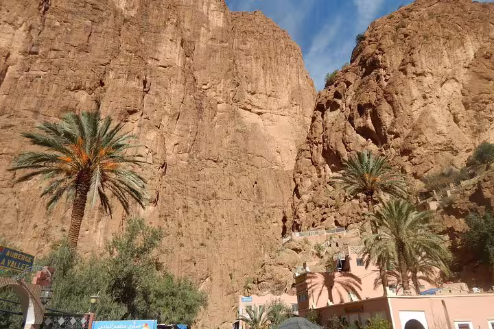 Palm oasis and cliffside village at Todgha Gorge stop on 3-day private desert tour Marrakech to Fes