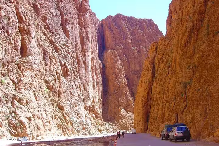 Driving through Todra Gorge canyon cliffs on a 3-day private desert tour from Marrakech to Fes, Morocco