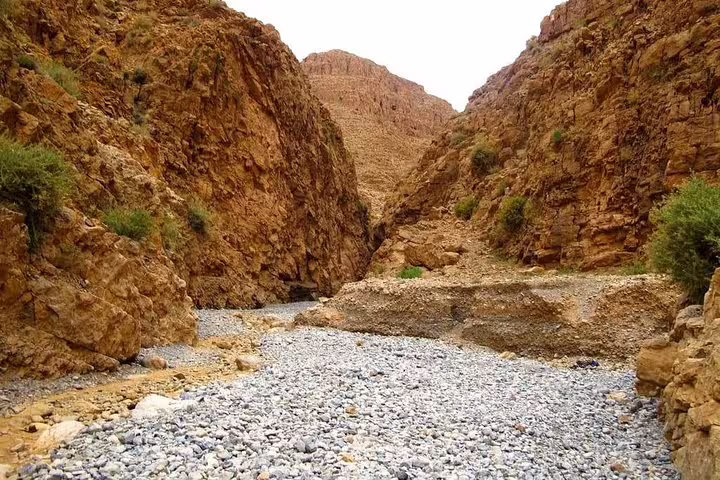 Rocky canyon riverbed in Todra Gorge near Tinghir, featured on Morocco 8-day tour from Tangier