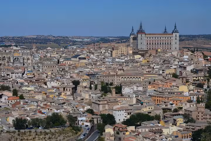 Aerial view of Toledo's historic cityscape with the Alcázar prominently featured, part of the Andalusia and Toledo tour.