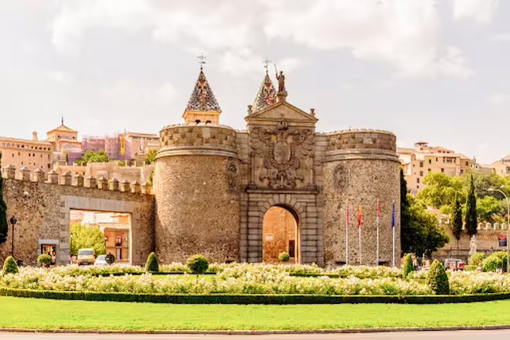 Private half-day tour to Toledo by minivan with Mercedes vehicles parked at scenic viewpoint overlooking the city