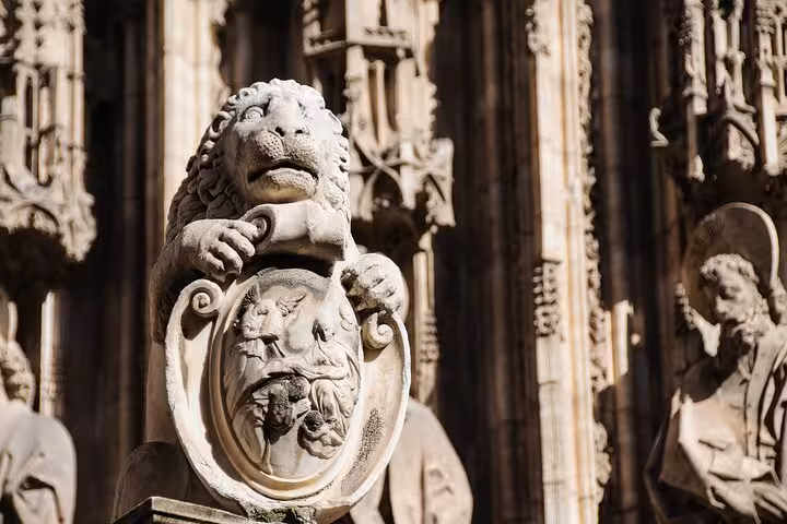 Intricate stone lion sculpture at a historic site in Toledo, highlighting detailed craftsmanship and cultural heritage.