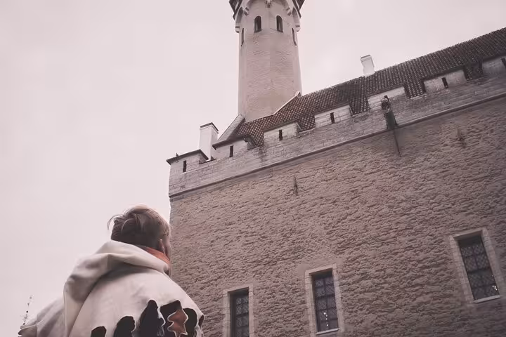 Tourist exploring Tallinn's historic Toompea Castle on Tales of Reval smartphone GPS walking tour