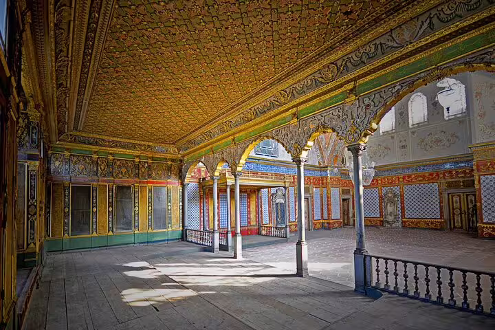 Ornate Topkapi Palace courtyard interior on a private guided day tour in Istanbul, with gilded arches and tiles