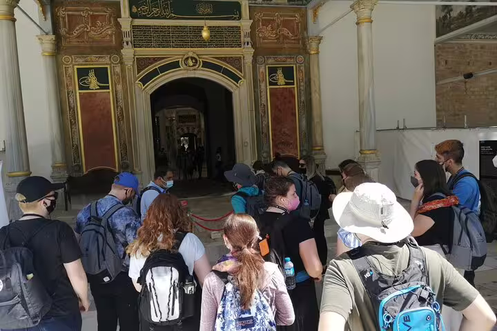 Visitors queue at Topkapi Palace entrance on Istanbul city tour including Hagia Sophia, Blue Mosque and Grand Bazaar