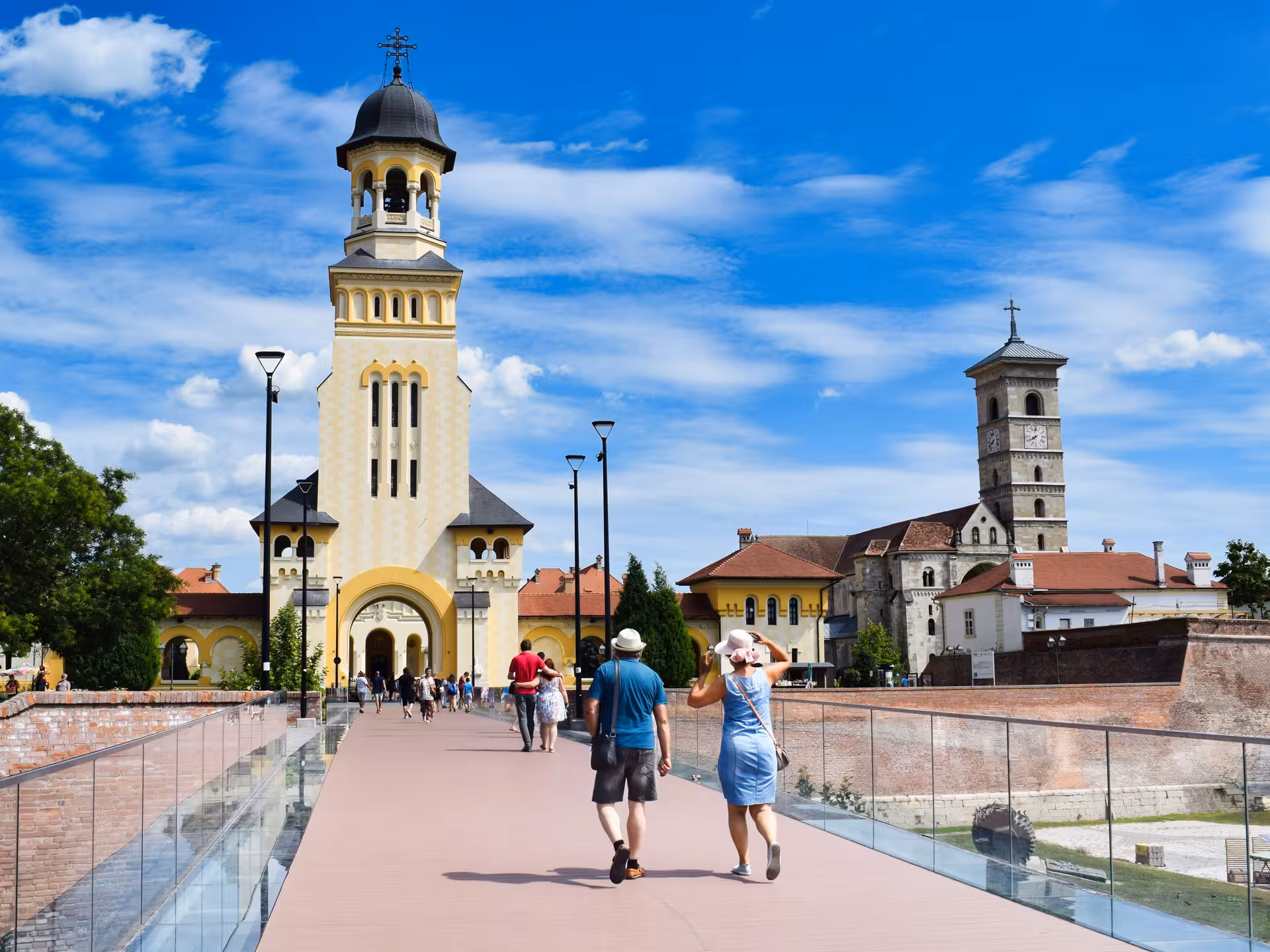 Tourists walking toward Alba Iulia Cathedral on a Best of Transylvania guided tour of Saxon towns