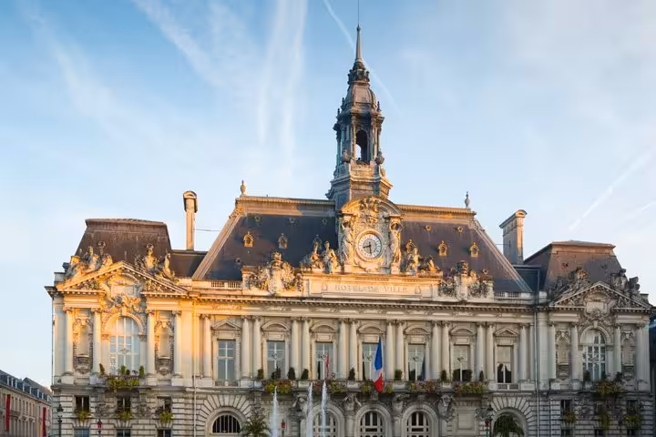 Ornate Hôtel de Ville city hall facade with clock tower in Tours, France