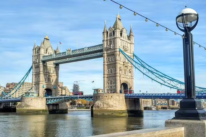 Tower Bridge over the River Thames in Southwark, London, with blue suspension cables and Gothic towers