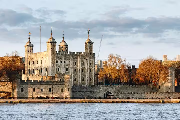 Historic Tower of London by the River Thames, showcasing medieval architecture and a key highlight of the private London tour.