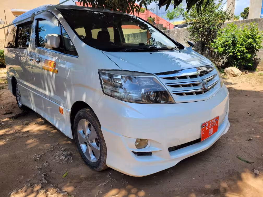 Toyota Alphard minivan rear view used for private airport transfers to Pongwe hotels in Zanzibar.