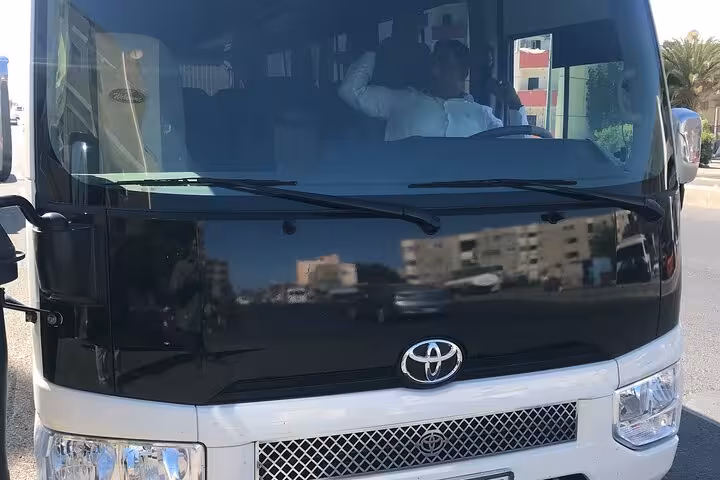 Front view of Toyota minibus used for Hurghada private transfer, reliable airport and hotel shuttle service