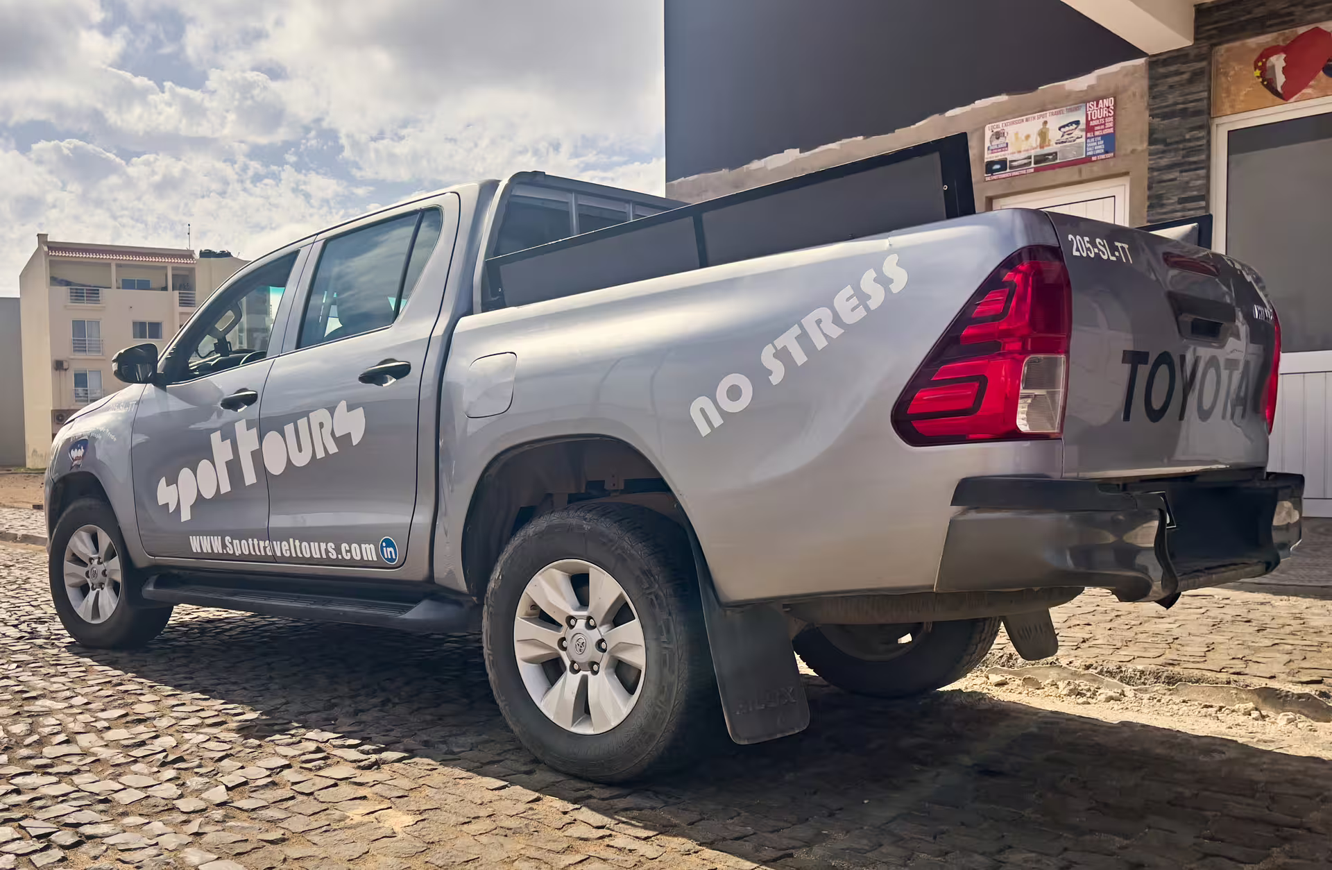 Toyota pickup branded for transfers, perfect for private airport transfer, hotel pickup, and luggage transport
