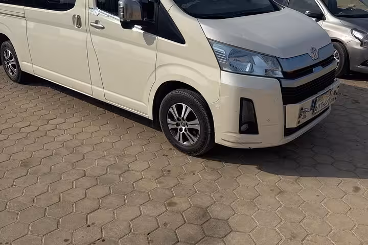 Spacious Toyota van for private transfer from Cairo International Airport to Giza, ideal for families and groups