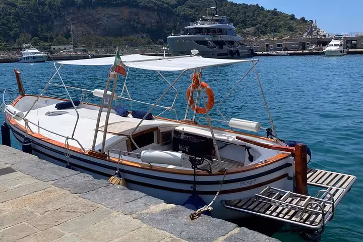 Traditional boat docked in La Spezia harbor, perfect for sunset tours in Golfo Dei Poeti's serene waters.