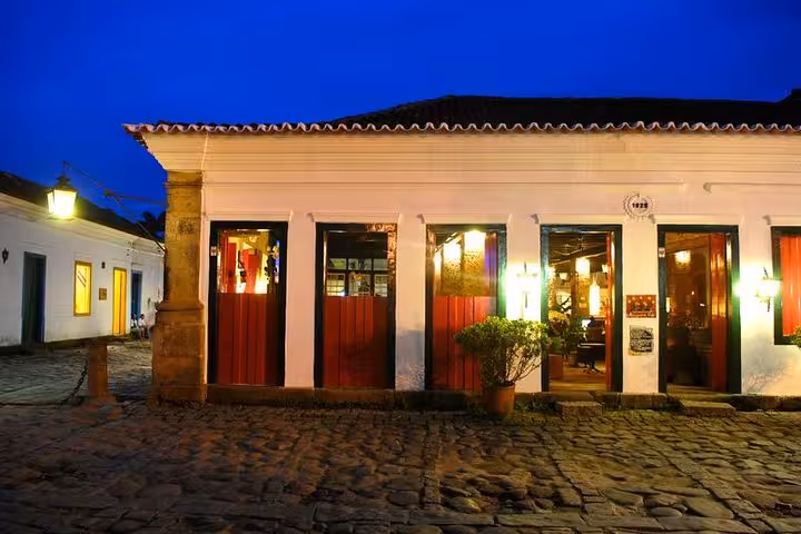 Charming exterior of a traditional Brazilian diner, inviting guests for a night of live music and caipirinhas.