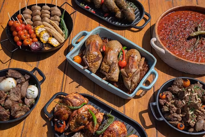 Traditional Egyptian feast spread with grilled meats, stuffed birds, and spicy dips on a local food tour