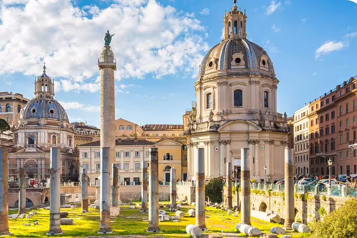 Trajan's Column and ancient Roman ruins with baroque church domes on Rome self-guided audio scavenger hunt tour